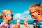 Cute boy and girl eating ice cream on beach