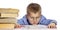 Cute boy in glasses of school age is tired of learning. I hung my head on textbooks. Close-up. Isolated on a white background