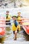 Cute boy in helmet and live vest ready for rafting on the catamaran