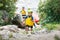 Cute boy in helmet and live vest ready for rafting on the catamaran