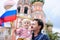 Cute boy and his father holding russian flag