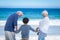 Cute boy holding his grandparents hands