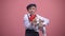Cute boy holding puppy with red bow, cute pet, animal for birthday present