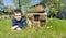 Cute boy made an insect house or a dormitory for bugs and beetles to protect the environment in the garden. Ideas of summer