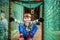 Cute boy overcomes obstacles in rope adventure park. Summer holidays concept. Happy kid playing at rope adventure park. Amusement