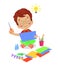 Cute boy painting and cutting colorful craft papers