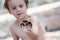 Cute boy, playing with little crab on the beach