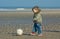 Cute boy playing soccer