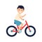 Cute boy with rise hand riding bicycle. Happy child rides red modern bike.