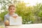 Cute boy shows drawn pear. Open air. Garden in the background. Creative concept