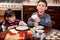 Cute boy and sister baking cookies