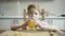 Cute boy sitting at the table with glass of orange juice and waiting for a other family to have a meal overrun camera