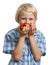 Cute boy smelling a bunch of tomatoes