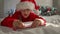 Cute boy writes letter to Santa Claus. Preparing for holiday. Christmas miracle Wish List. Child lying on bed at home