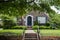 Cute brick house with rounded top rustic front door and lush landscaping flying an American Flag - Americana Curb Appeal