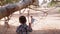 Cute brothers playing in the park with trees on sunny summer day. Kids enjoying fresh air