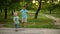 Cute brothers playing in summer park. Smiling siblings spending time together