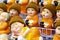 Cute buddhist monk figurines with spectacles and woolly hats