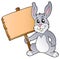 Cute bunny holding wooden board