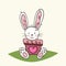 Cute bunny out from inside a colored vase