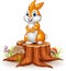 Cute bunny standing on tree stump