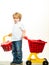 Cute buyer customer client hold shopping cart. Kids store. Boy child shopping. Big purchase. Kid hold plastic shopping