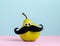 Cute card pear with googly eyes and moustache pink blue background
