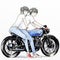 Cute cartoon boy and girl riding her motorcycle