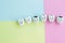 Cute cartoon healthy and decayed teeth icon on pastel backdrop