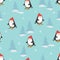 Cute cartoon skiing penguins seamless pattern.