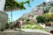 Cute cat, on background Positano panoramic view, Amalfi coast, Italy