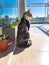 Cute Cat on the balcony watching the outside. Cat enjoying the views of the buildings.