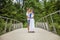 Cute Caucasian couple hanging a lock on the bridge as a sign of eternal love