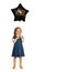 Cute Caucasian girl child 4-5 years old spoiling merrily happy with black star-shaped gel balloon with inscription Happy Birthday