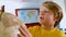 Cute Caucasian schoolboy studying the globe in a classroom at school