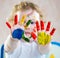 Cute cheerful girl with painted hands