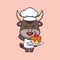 Cute chef bull mascot cartoon character with cake.