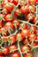 Cute cherry tomatoes on wooden background