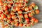 Cute cherry tomatoes on wooden background