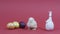 Cute chick clucking, easter bunny and colorful eggs. Pink background. Video card