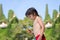 Cute child, boy, eating croissant on the beach