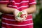 Cute child, boy, eating small cupcake of Pavlova desert, light egg and sugar desert with cream and strawberries