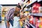 Cute child choosing food from shelf