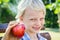 Cute child choosing red apple for a snack