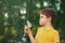 Cute child with dandelions outdoors.