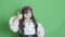 Cute child dressed as pirate showing thumb up. Isolated on green screen slow motion