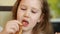 Cute child eating pancake. Baby girl eats breakfast