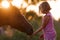 Cute child feeding her handsome horse