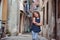 Cute child girl walking old city streets in Piran, Slovenia