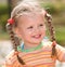 Cute child with long hair. Nature.